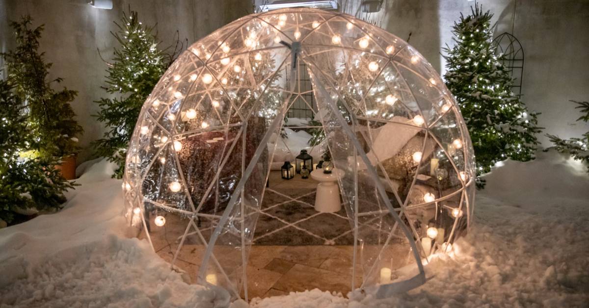 a dining igloo with warm lights