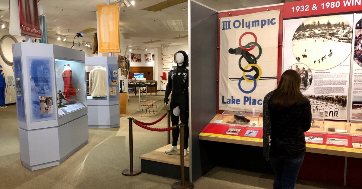 woman looking at an exhibit at the Olympic winter museum