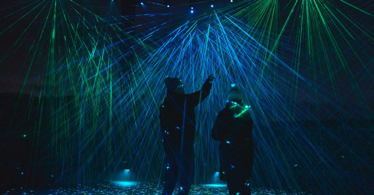 two people in a light show