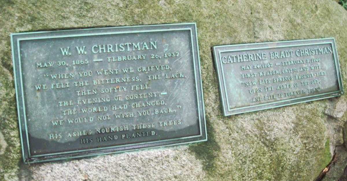 two plaques in a stone with writing engraved on them