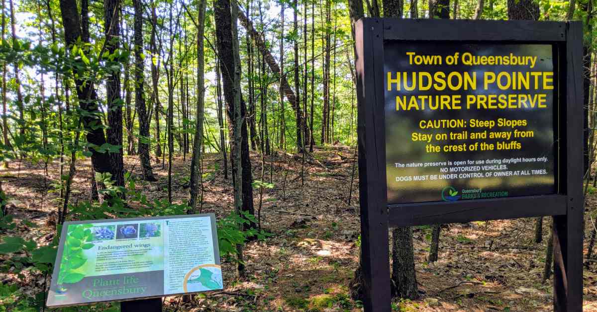information plaque and sign at trailhead of hudson pointe nature preserve