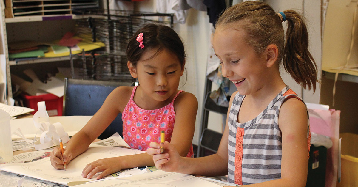 two girls doing an art project