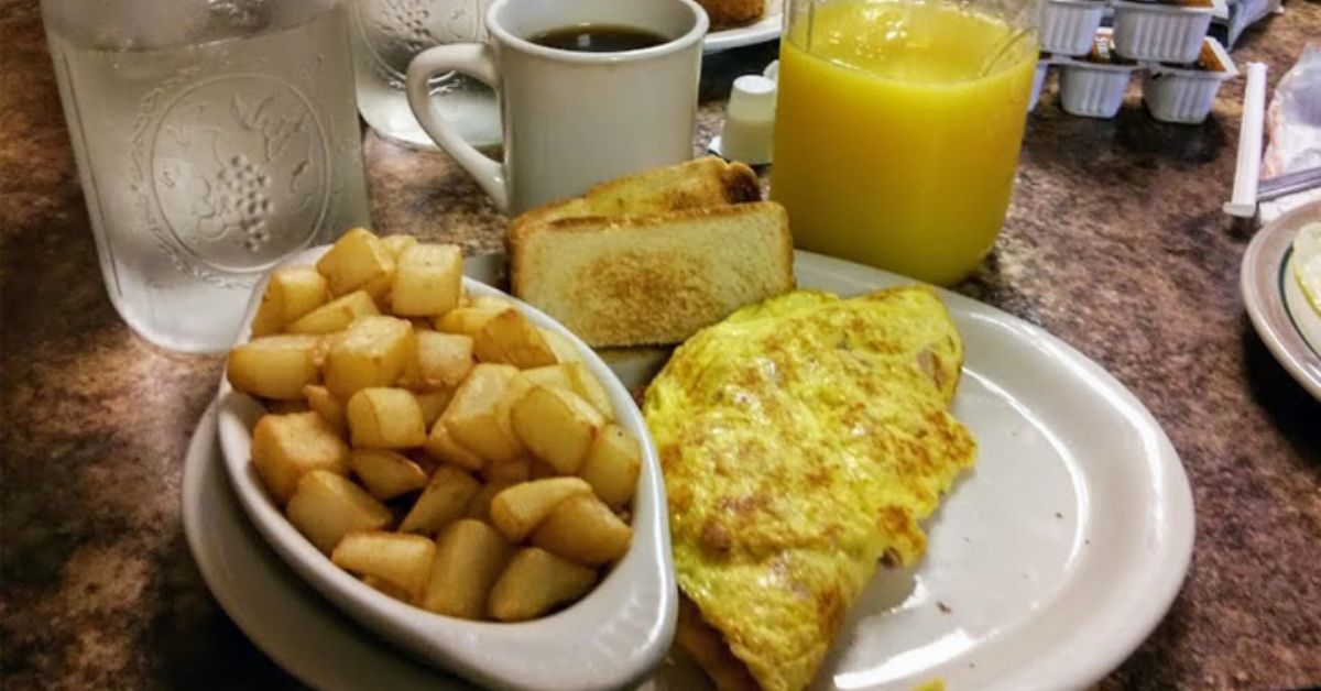 home fries, omelette, and orange juice