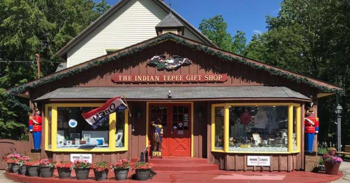 the exterior of a store with red doors