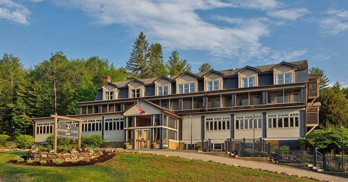 image of friends lake inn on a sunny day with trees in the background