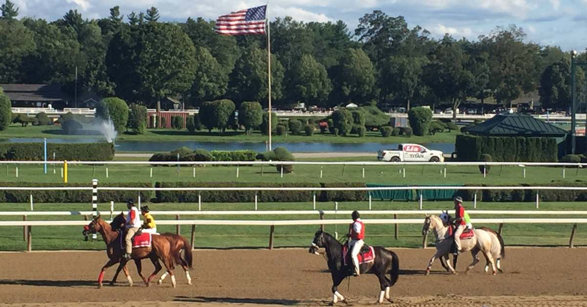 jockeys and horses on a racetrack