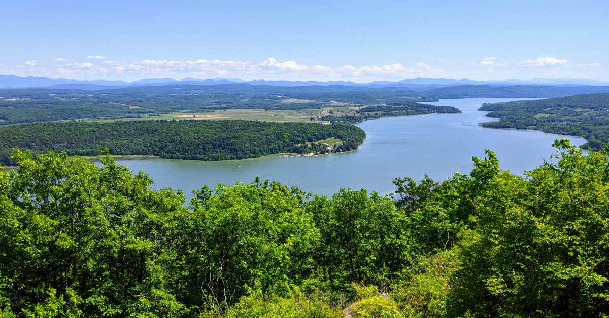 top of a mountain overlooking a lake