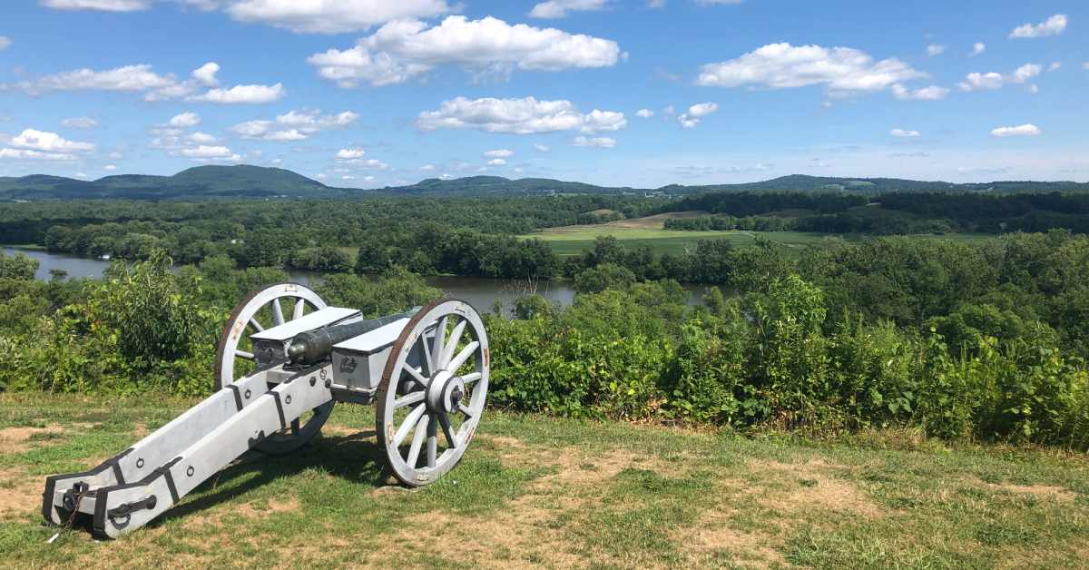 old cannon overlooking a river