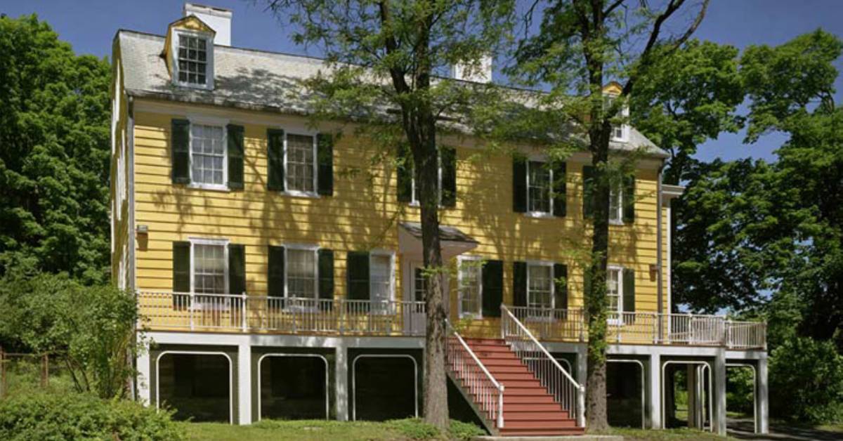 exterior of a yellow historic house