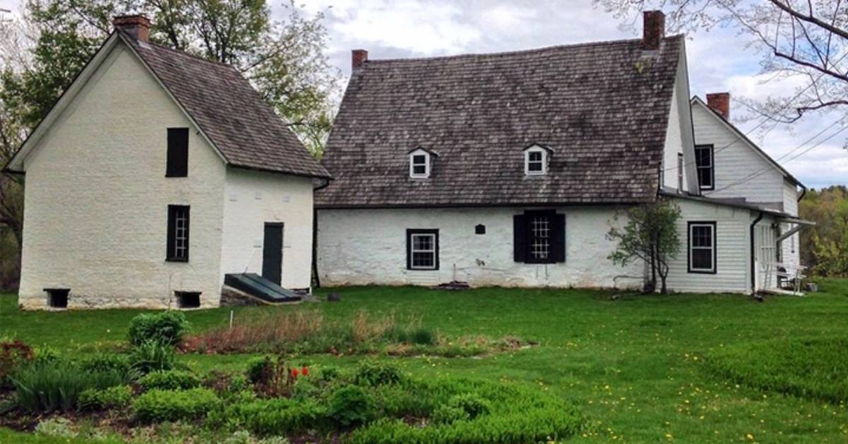 side view of two historic white buildings