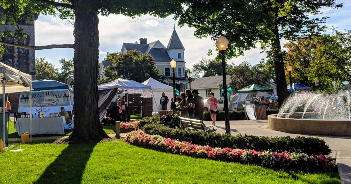 people and vendors at event near fountain