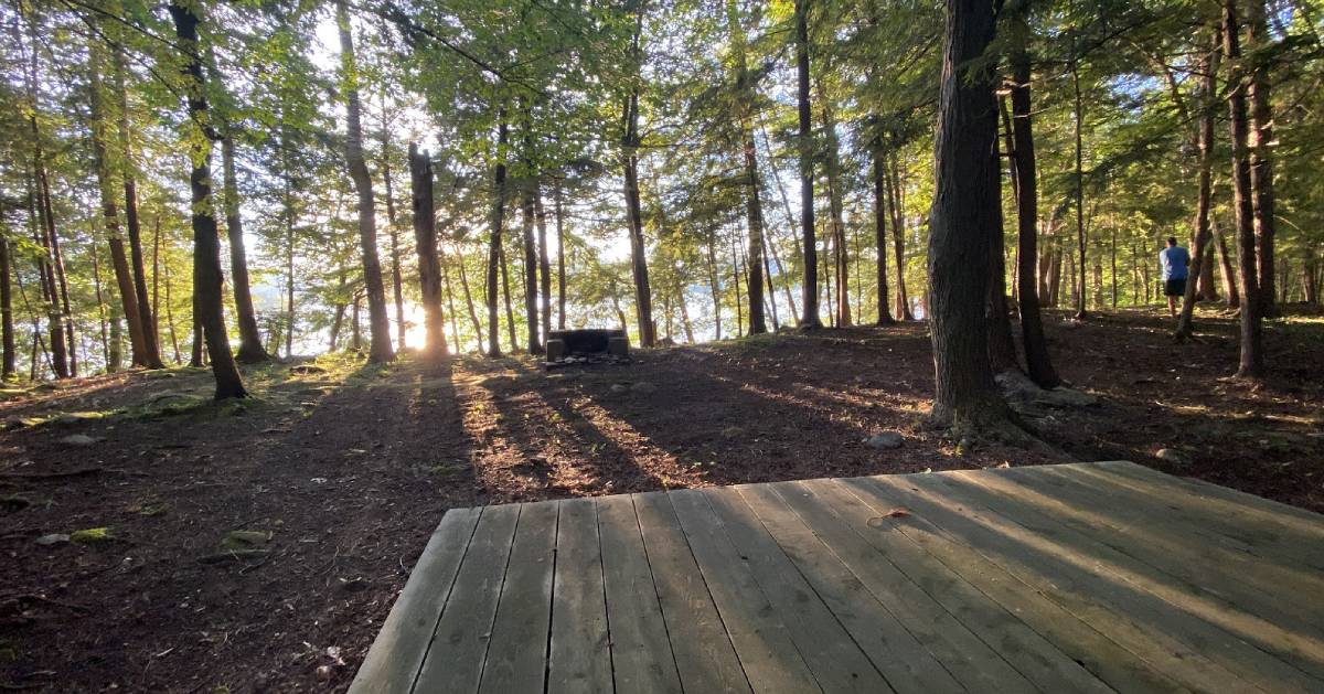 campsite with platform and fire pit