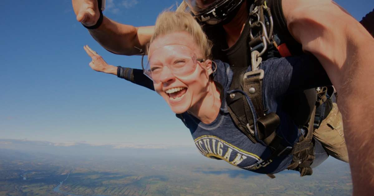 smiling woman skydiving