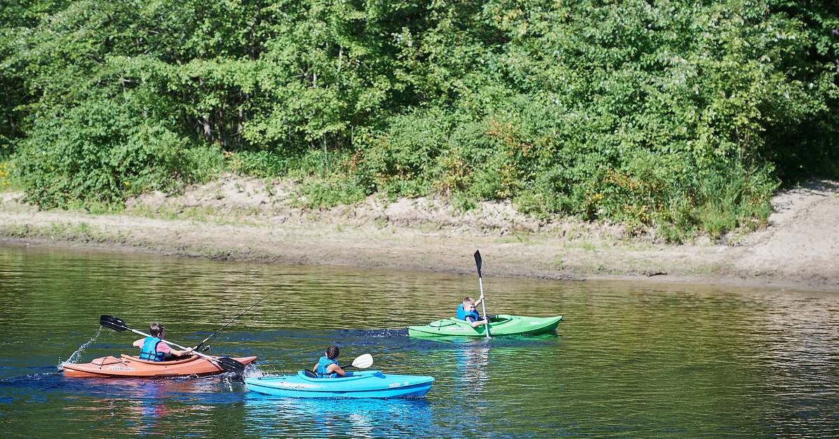 kids kayak in river