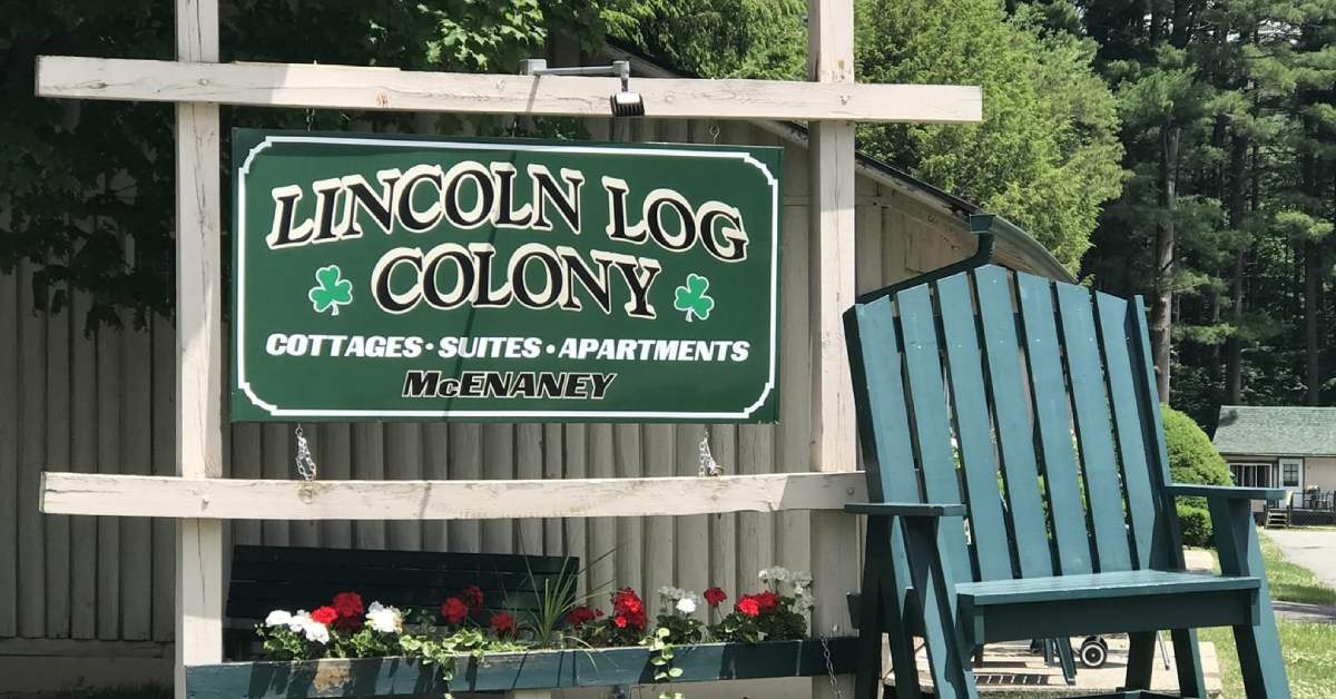 lincoln log colony sign with giant chair