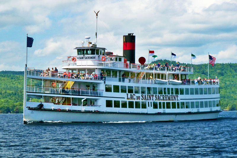 a large steamboat on a lake