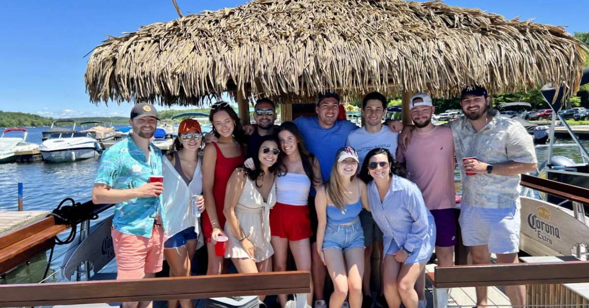 group on tiki boat poses