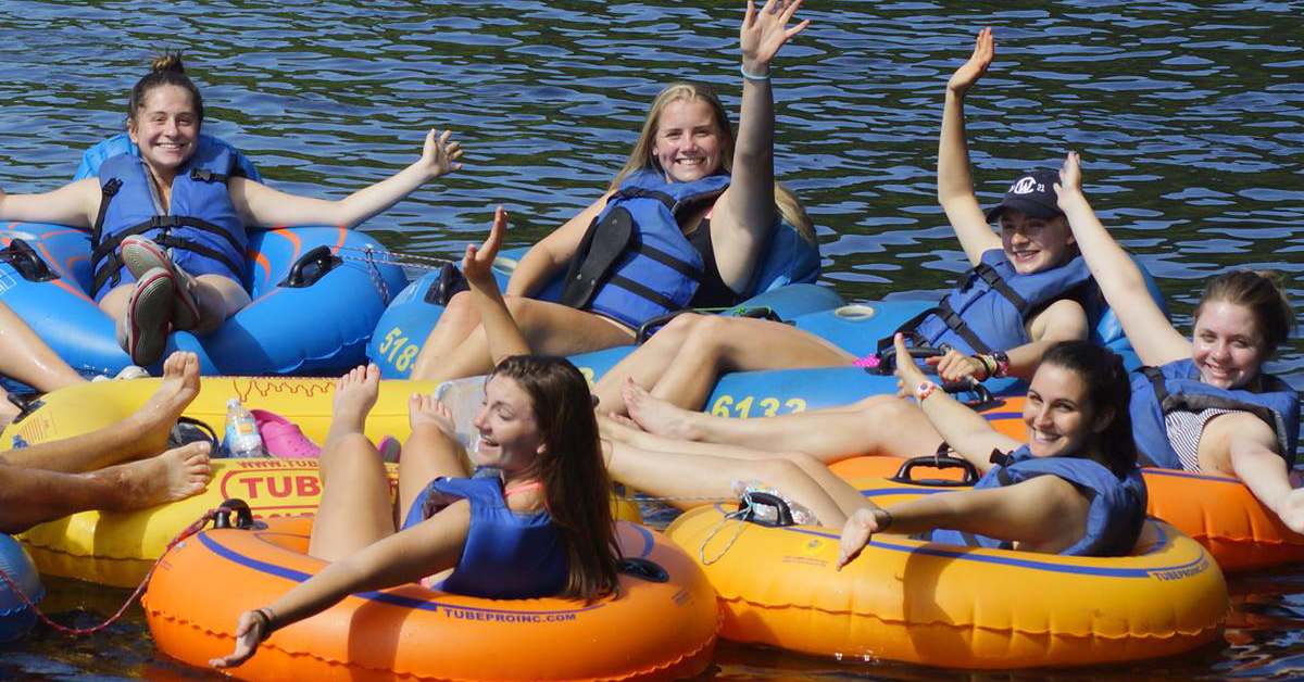 group of young women tubing wave