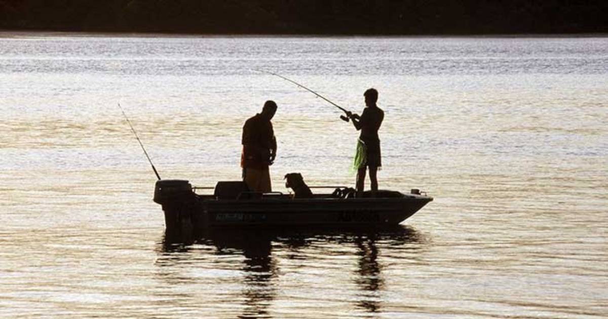 two people in small boat fishing