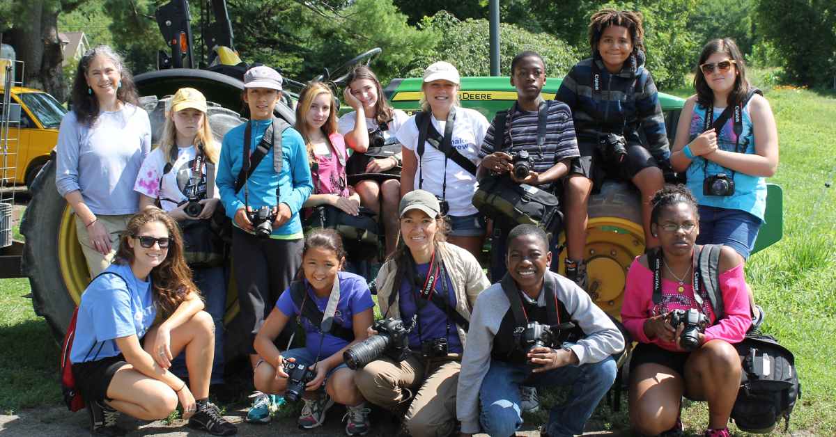 group of kids with cameras smiling