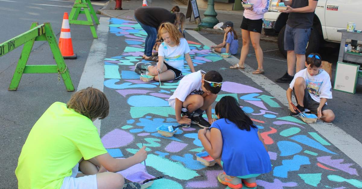kids painting a crosswalk