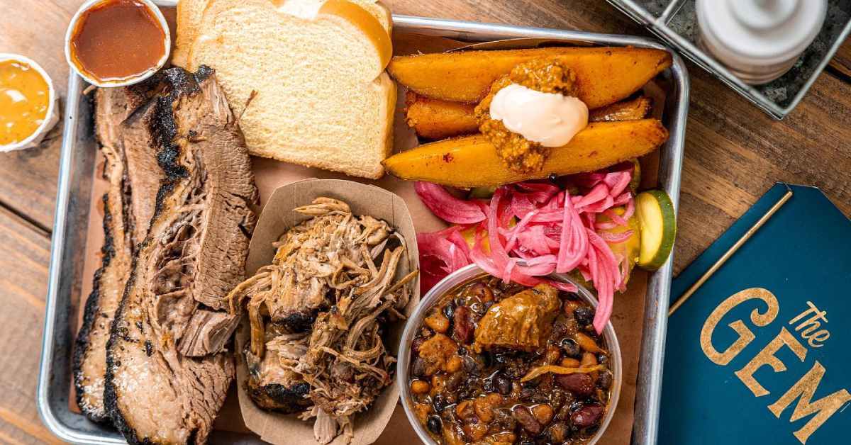 plate with brisket, bbq, sweet potato fries