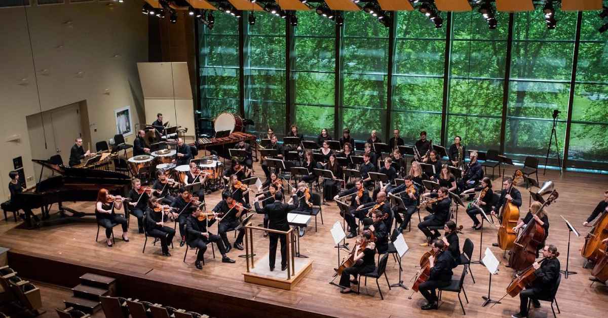 overhead view of an orchestra performing on a stage