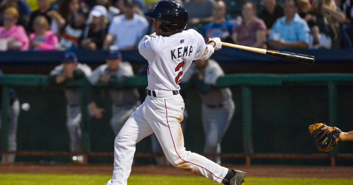 baseball player swings bat