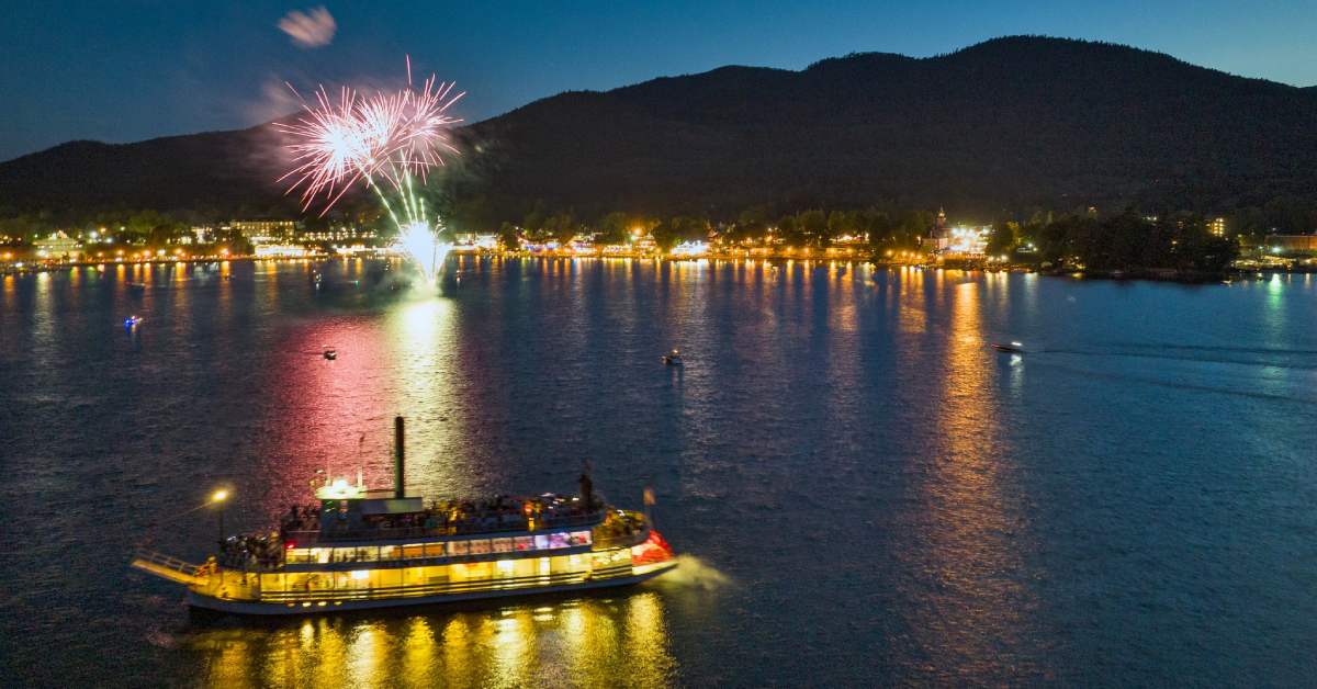 cruise ship on lake at night with fireworks
