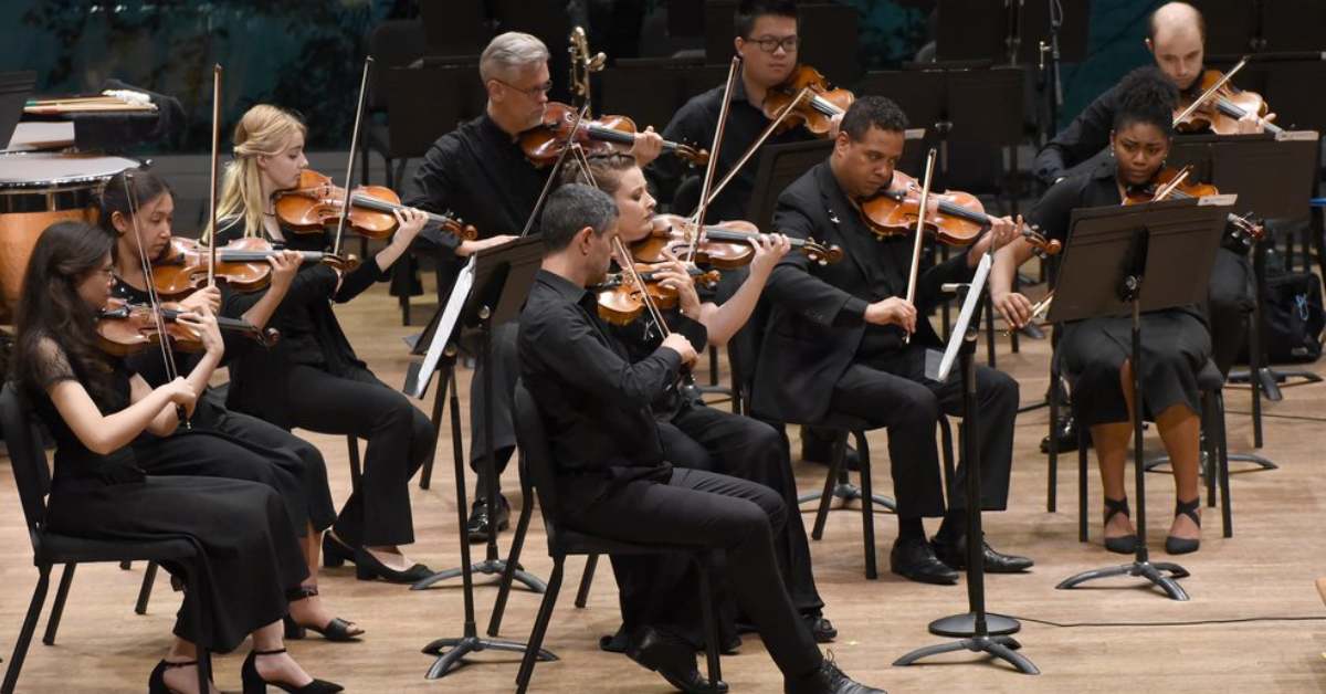 an orchestra performing on stage