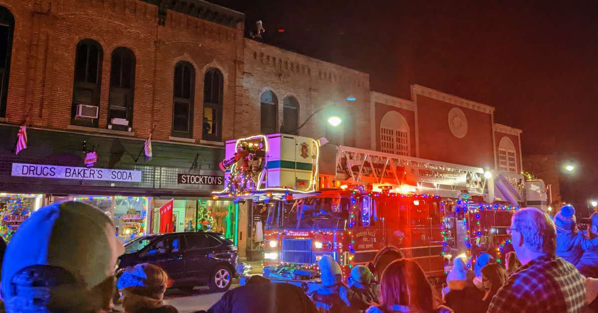 crowd and firetruck at santa roof rescue