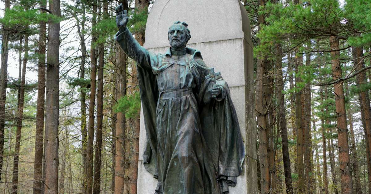 statue with hand raised