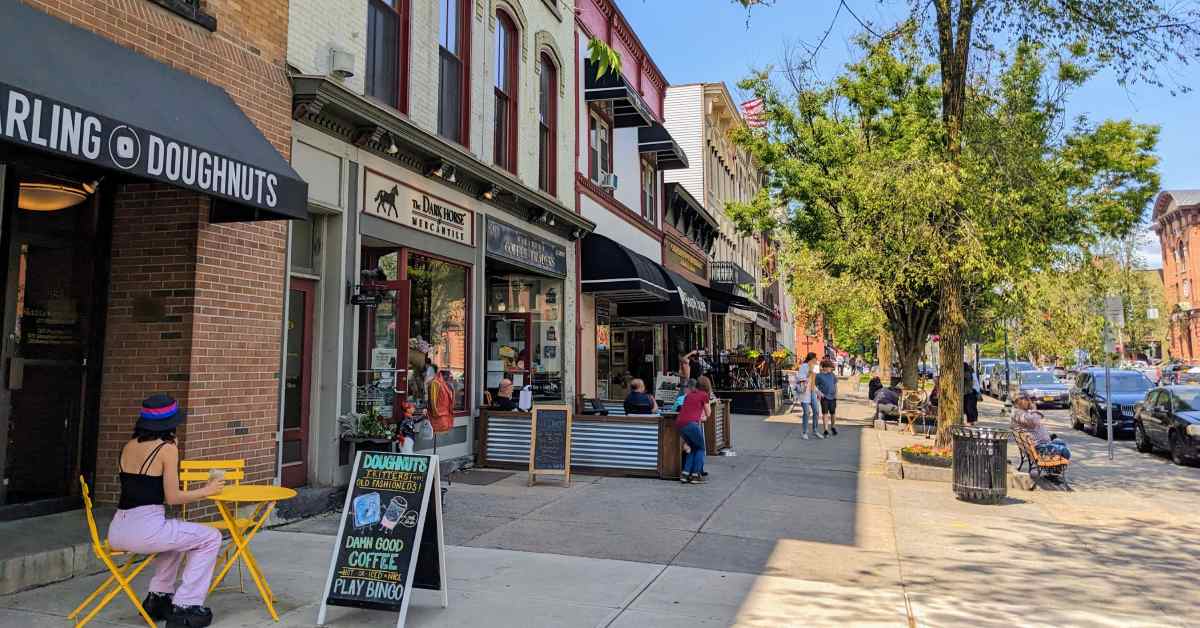 a busy street in the city on a sunny day