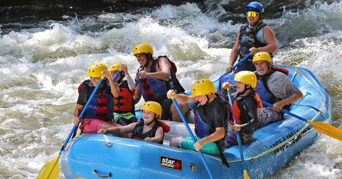 group of people whitewater rafting