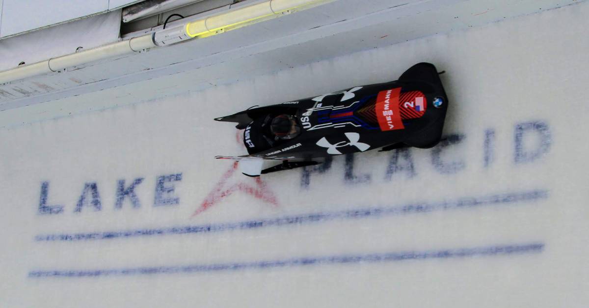 person racing in a bobsled