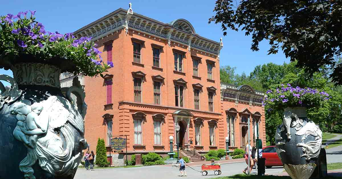 people near a brick museum building