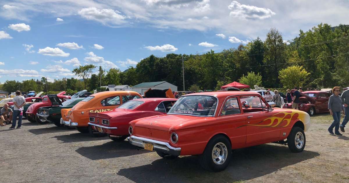 classic cars lined up at a car show