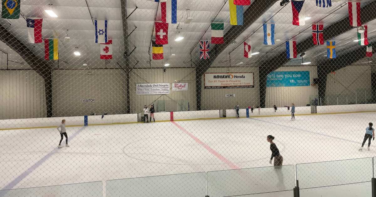 an ice skating rink with people on it