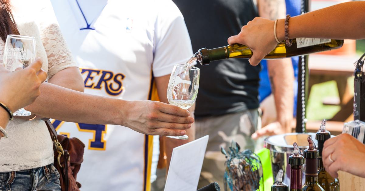 people getting samples of wine at an event