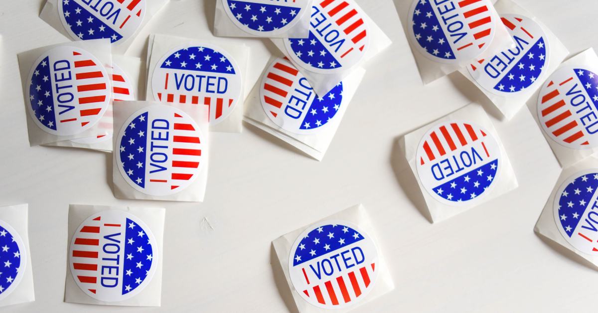 voting stickers scattered on a white background