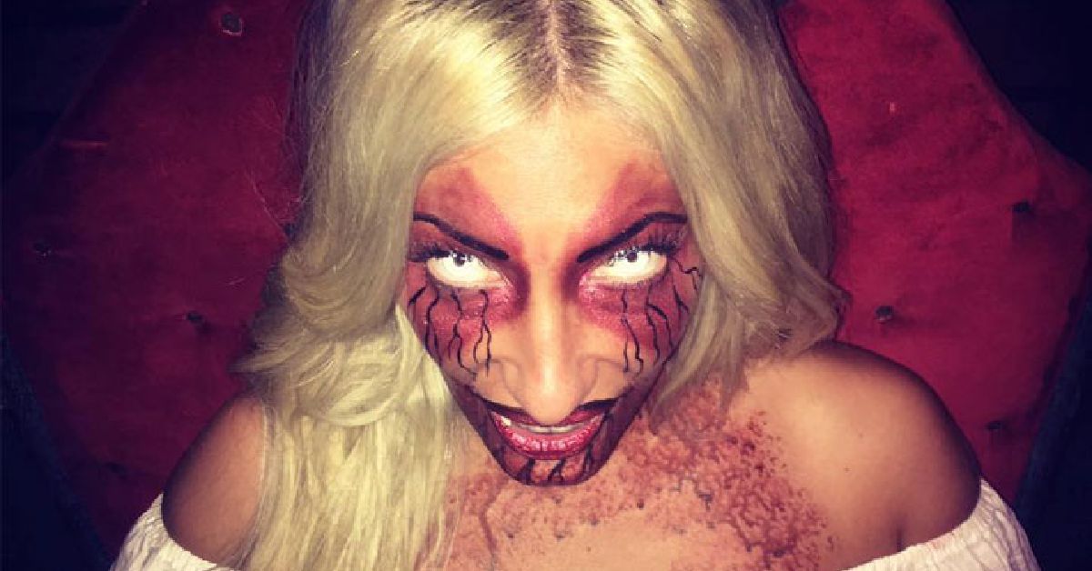 scary blond lady with crazy veins around eyes and blood all over