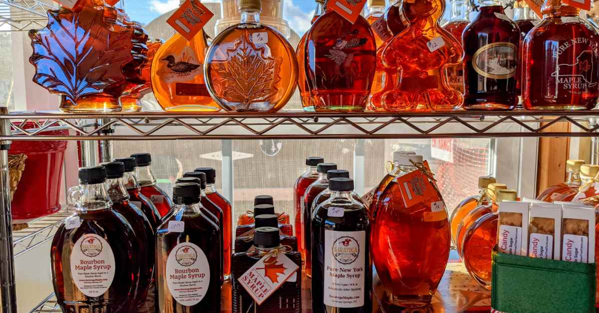 bottles of maple syrup on a shelf