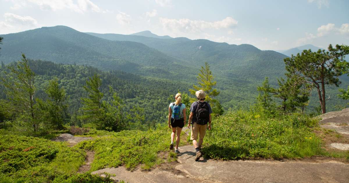 two people hiking a mountain