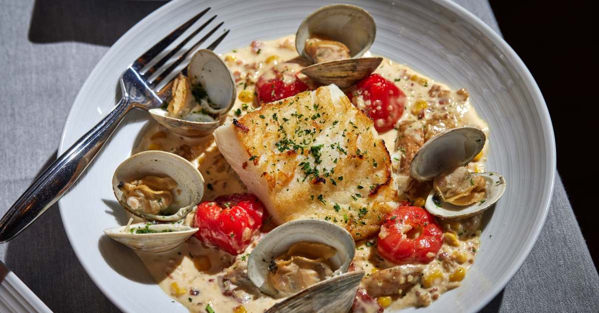 dish with seafood in it like fish and clams