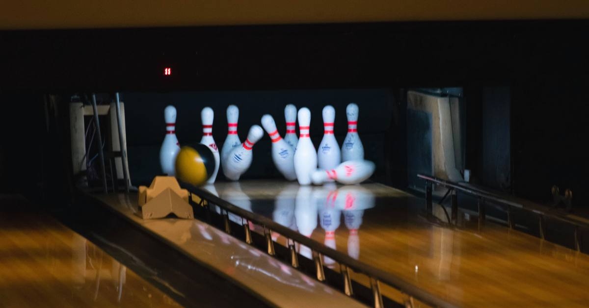 Bowling ball hitting pins