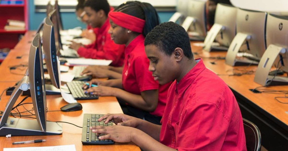 teenage students seated at computers