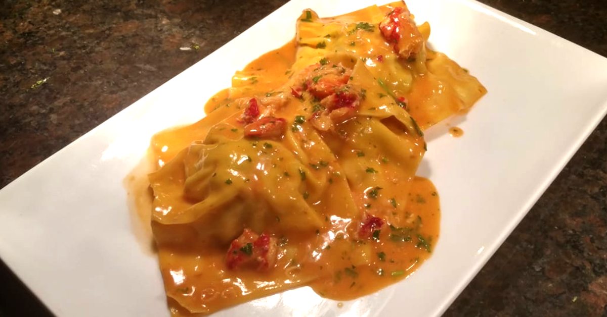 a plate of raviolis in sauce