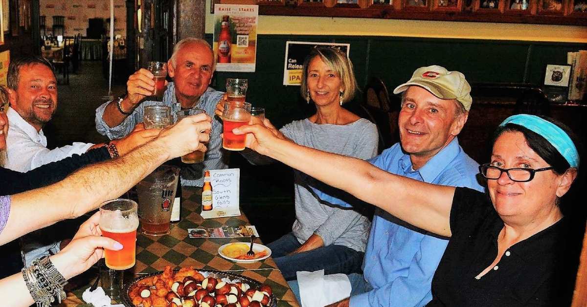 group of people cheersing at a table