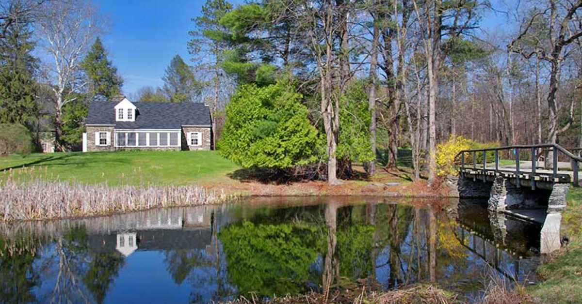 house overlooking a small pond