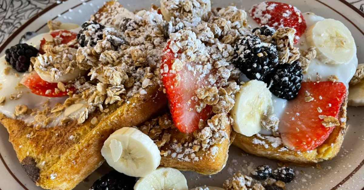 french toast with fruit and granola on it